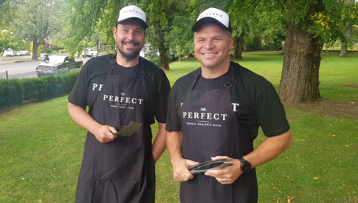 HAMMER AND TONGS: Carl Smith and Member for Orange Phil Donato are teaming up with men's health charity Mr Perfect to bring monthly support barbecues to the region. Photo: MATT FINDLAY