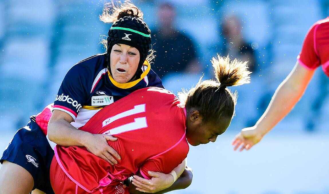CENTRE STAGE: Michelle Perry, one of the Brumbies' Wallaroos, brings down Queensland's Ivania Wong. Orange's Jacky Lyden could play alongside Perry in the ACT's centres. Photo: RUGBY.COM.AU/STUART WALMSLEY