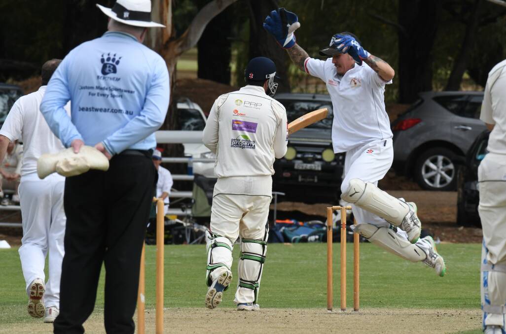 POWER: Spring Hill gloveman Dal Marsh, pictured celebrating a wicket in last summer's semi-final, has bludgeoned his way to the top of the Third Grade run-scoring stakes. Photo: JUDE KEOGH