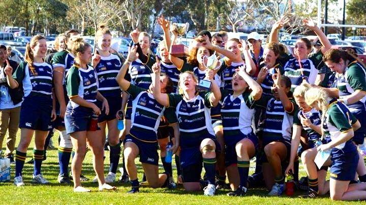 THE BEGINNINGS: Grace Hamilton (fourth from right, front row) celebrates Norths-Uni's premiership back in 2014. 