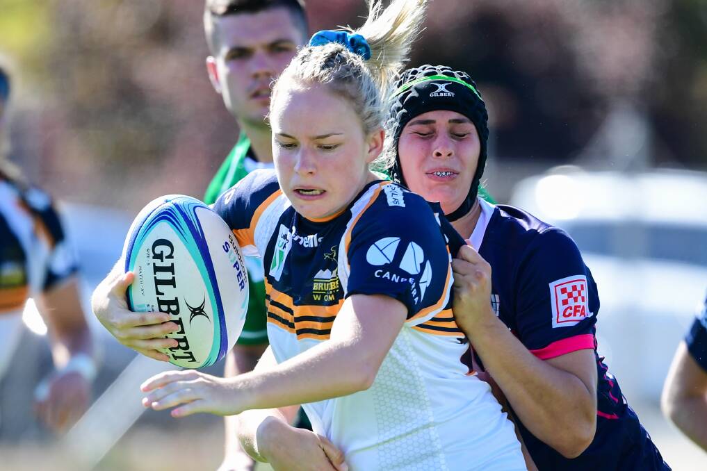 EXPERIENCE: Em McDonald tries to find some space in round two of the Super W season, she'll bring what she's learned back to Emus. Photo: RUGBY AU MEDIA/STUART WALMSLEY