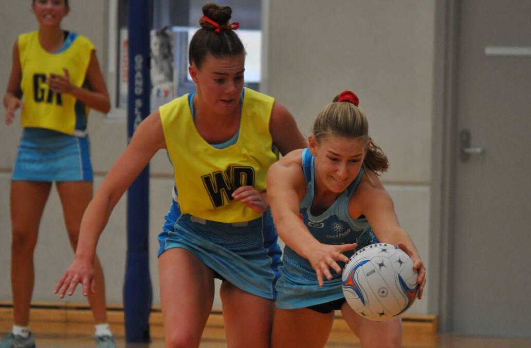 TOE-TO-TOE: Alex Emerson and Annie Miller fight for possession during Sunday's all-NSW HeartKids Cup decider. Photo: NICK McGRATH