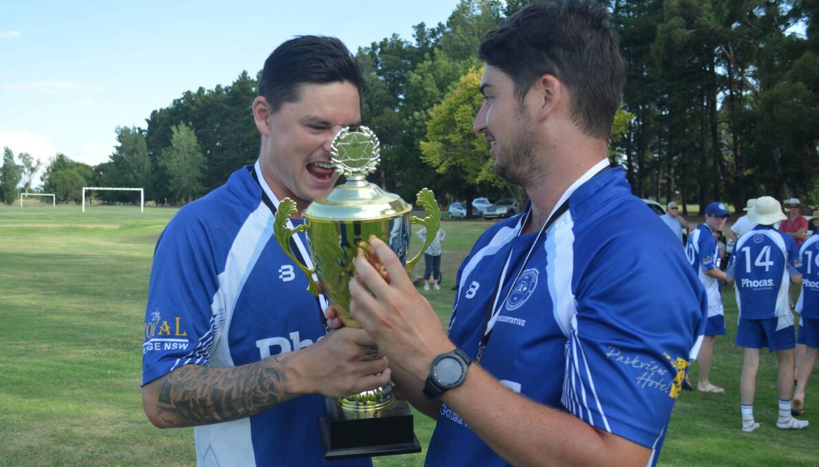 BLUE MOON: Ed Morrish and Josh Doherty celebrate last summer's title win, the former is hopeful of leading the Bluebaggers to another victory. Photo: MATT FINDLAY