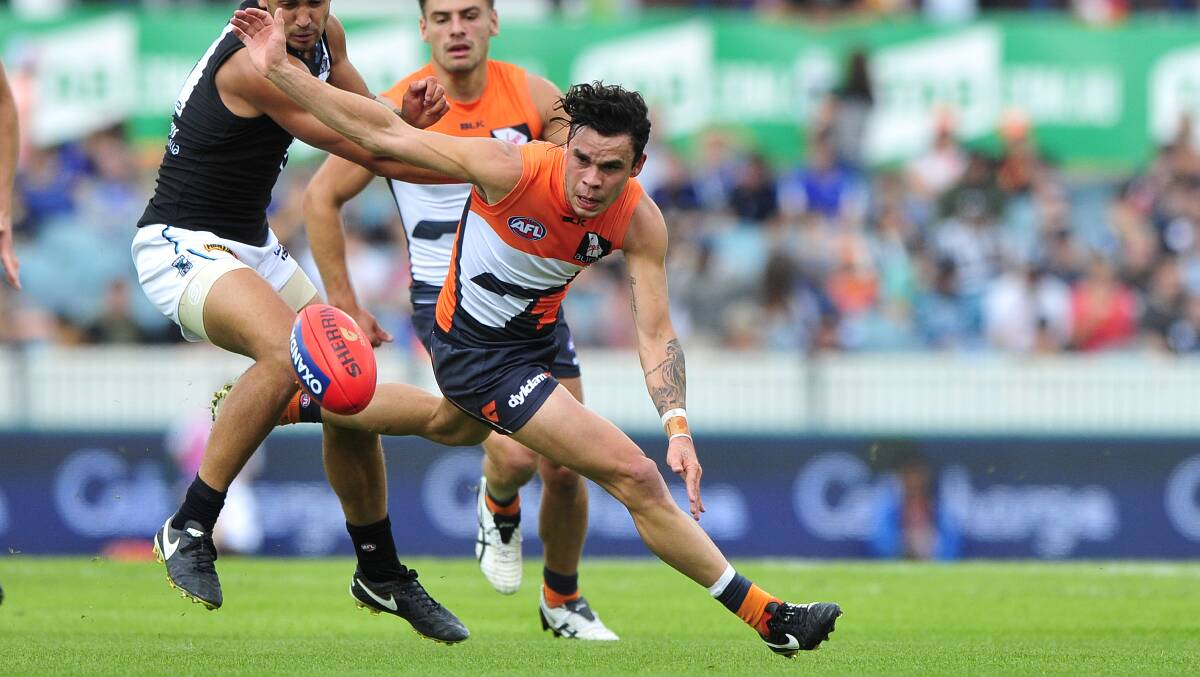 CONTEST: GWS' Zac Williams fights hard for possession against Port Adelaide at Canberra's Manuka Oval. Photo: JEFFREY CHAN