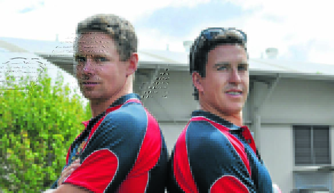 MATESHIP: Dom Maley and Tim Mortimer back in 2013, before a local derby while he latter was in charge at Hawks. Photo: NICK McGRATH