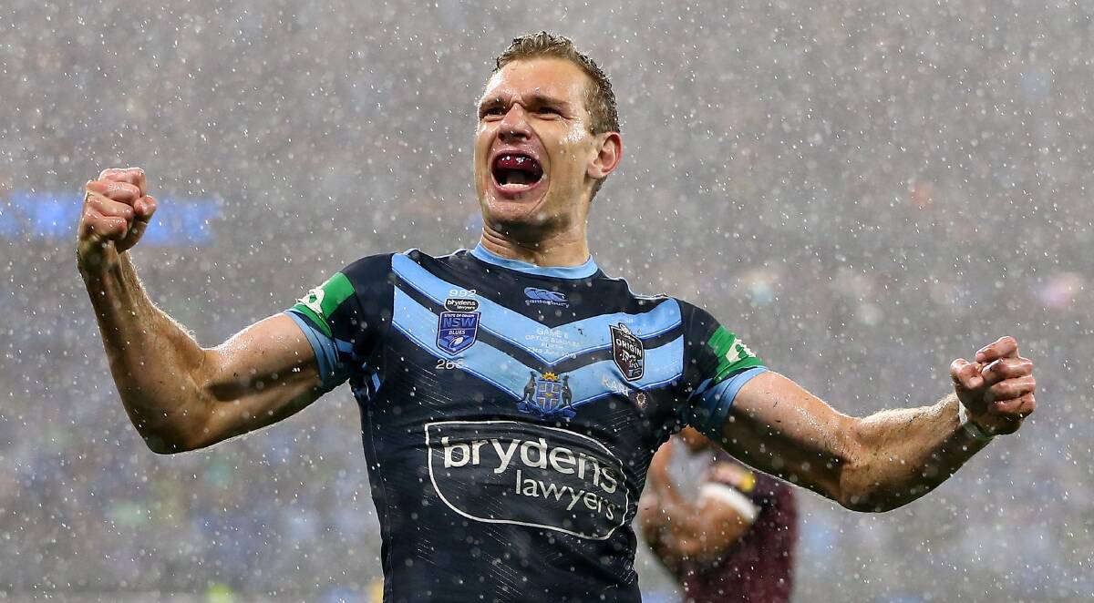 UNBELEIVABLE: Tom Trbojevic celebrates one of his three tries on Sunday night, the first NSW Origin hat-trick since 2005. Photo: AAP