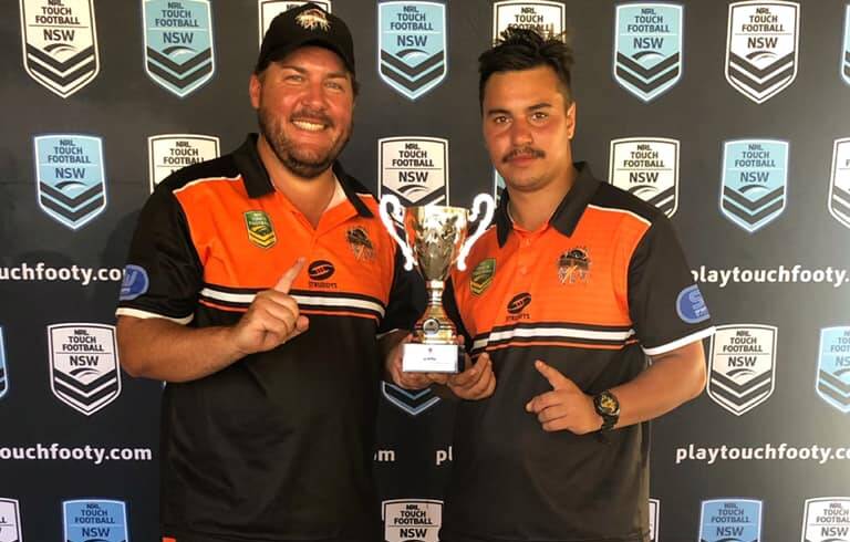 CLUB TITLE: Orange representative director Joel Begnell and coach Mitch Leonard show off their club championship spoils from last weekend. Photo: CONTRIBUTED