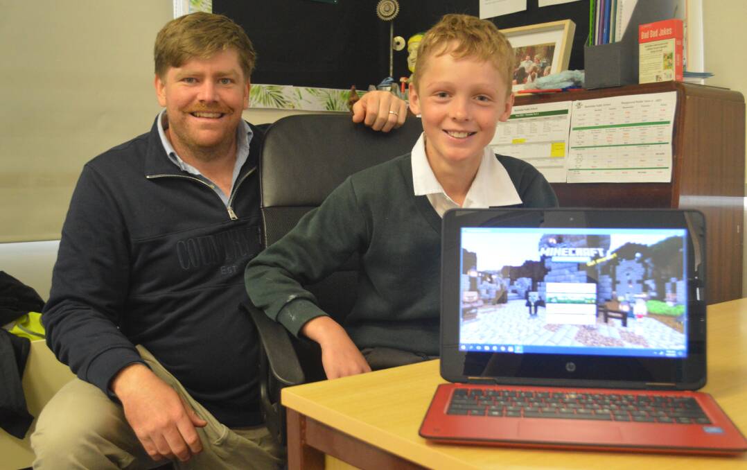 GOLDMINE: Nashdale Public School teacher Matt Campbell and year six student James Berryman have seen the benefits of Minecraft as an educational tool. Photo: MATT FINDLAY