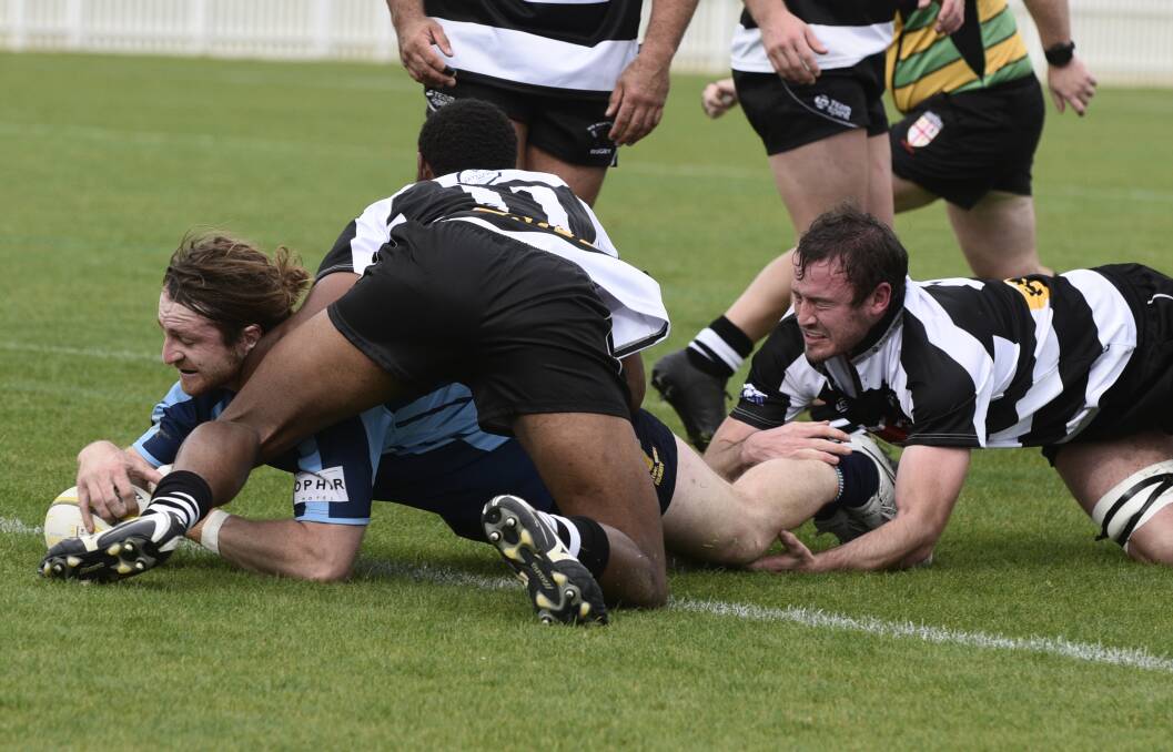 THE INSPIRATION: Emus' Lachie Harris dives over for the first of his two tries in Saturday's win. Photo: SAMANTHA NEWSAM