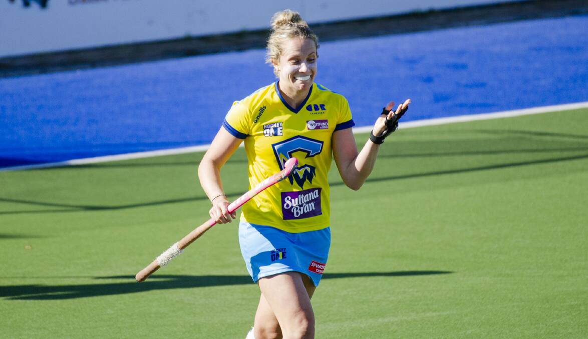 ICE TO SEE YOU: Edwina Bone trots back after nailing her shot in Canberra's shoot-out victory over the Brisbane Blaze. Photo: JAMILA TODERAS