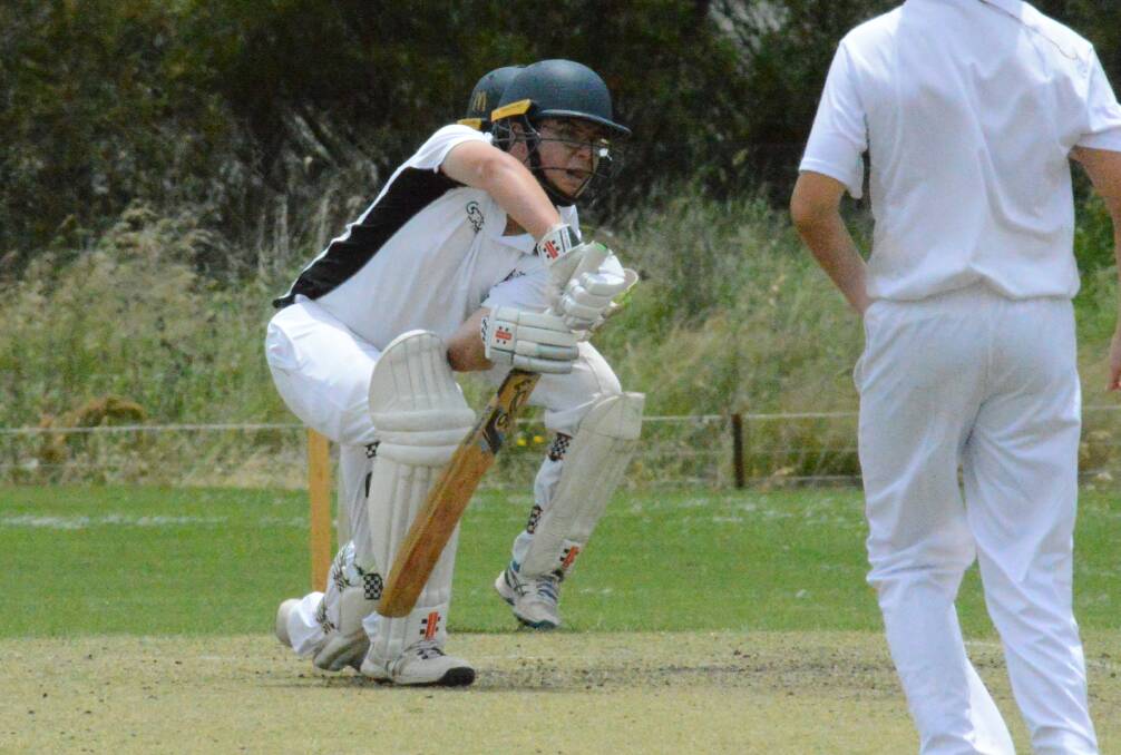 WELL PLAYED: Mitchell's Ollie Hollow looks for a single in last week's win over Lachlan. His under-14 side is chasing glory this weekend. Photo: MATT FINDLAY
