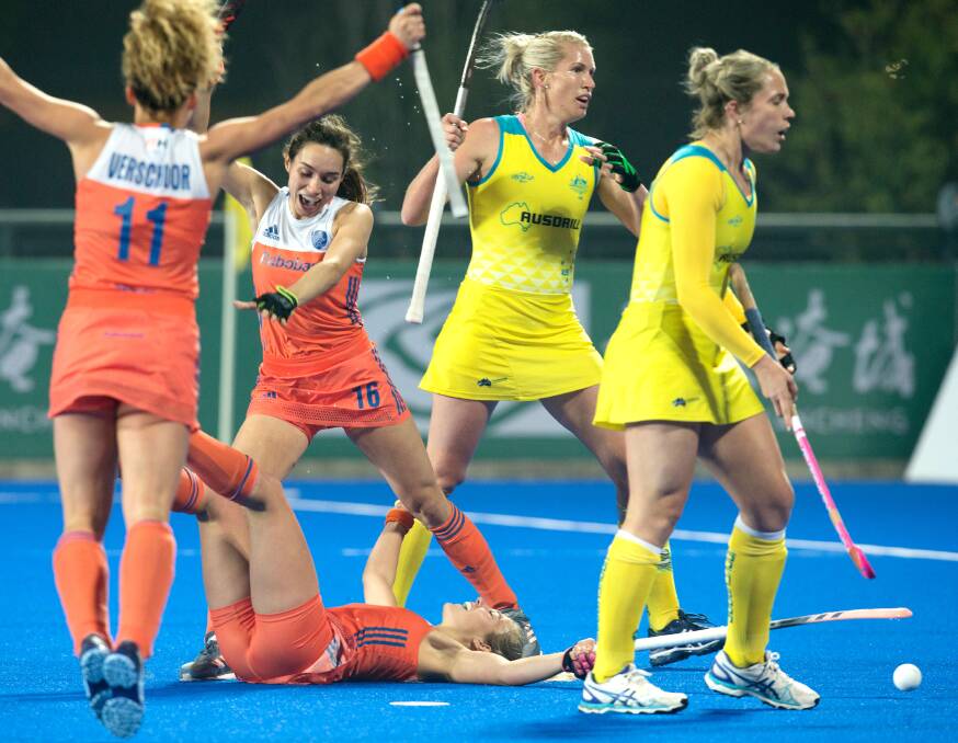 DECIDER LOSS: The Netherlands celebrate a goal against Edwina Bone's (right) Hockeyroos in the Champions Trophy final. Photo: WORLD SPORT PICS