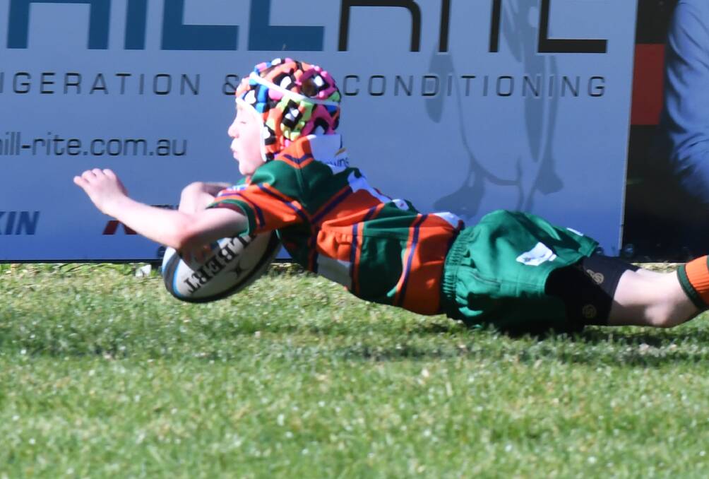 TRY TIME: Orange City youngster Tom Wythes dives over for a try in the opening gala day of the year, he was outstanding again on Sunday. Photo: CARLA FREEDMAN