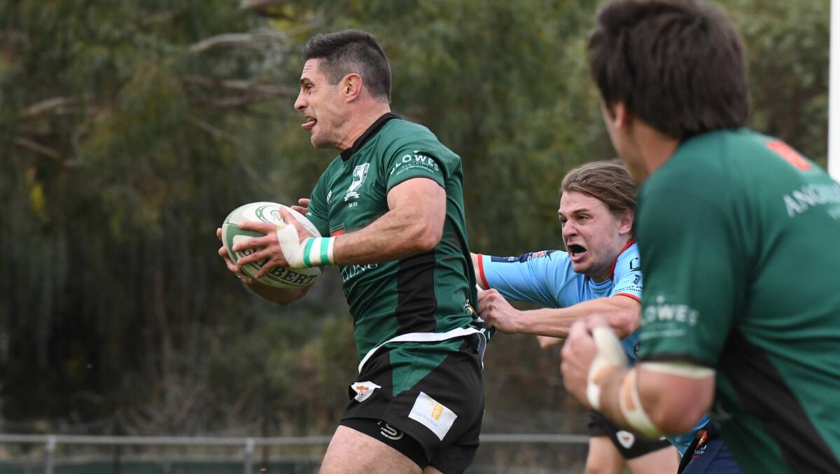 CAPTAIN'S KNOCK: Nigel Staniforth streaks away to one of his two tries in the greens' win on Saturday. Photo: JUDE KEOGH