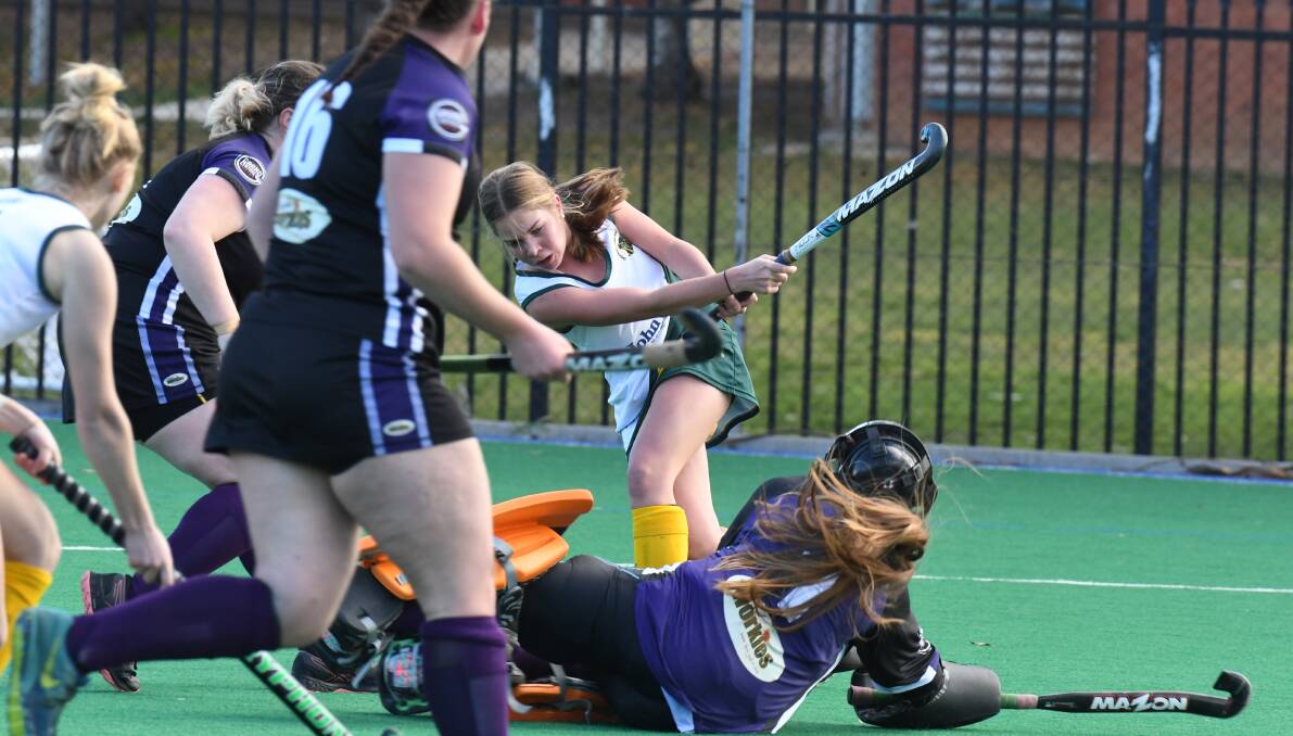 SLAP SHOT: Jemma Luelf rockets a shot into the back of the net during CYMS' monumental win over Lithgow Panthers on Saturday. Photo: JUDE KEOGH