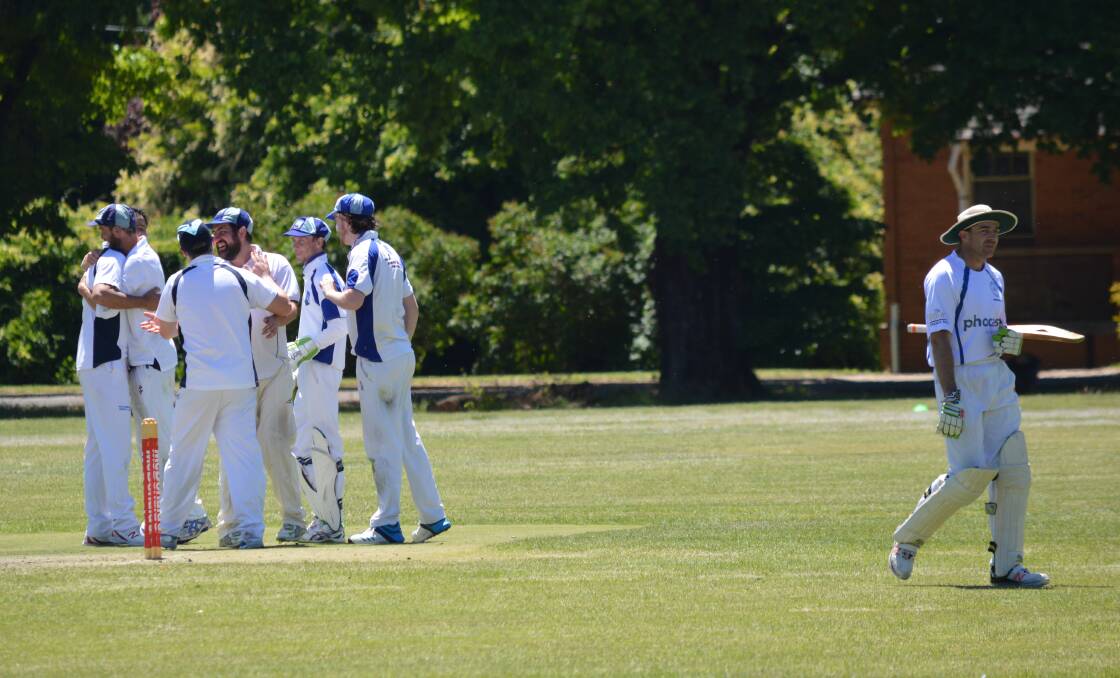 GOT HIM, GONE: The Blue Mountains celebrate as dejected Orange skipper Daryl Kennewell trudges off after being dismissed on Sunday.
