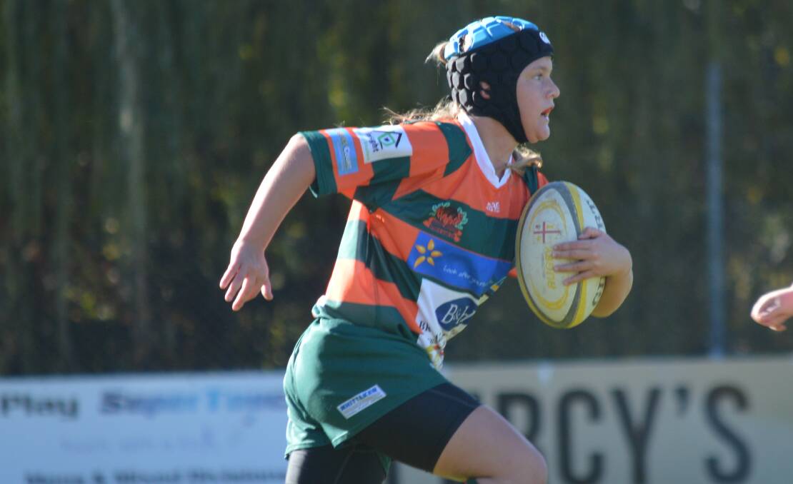 CHARGING FORWARD: Lily Bone's under-13 Lions might have gone down on Saturday, but she had a whale of a game, charging forward tirelessly. Photo: MATT FINDLAY