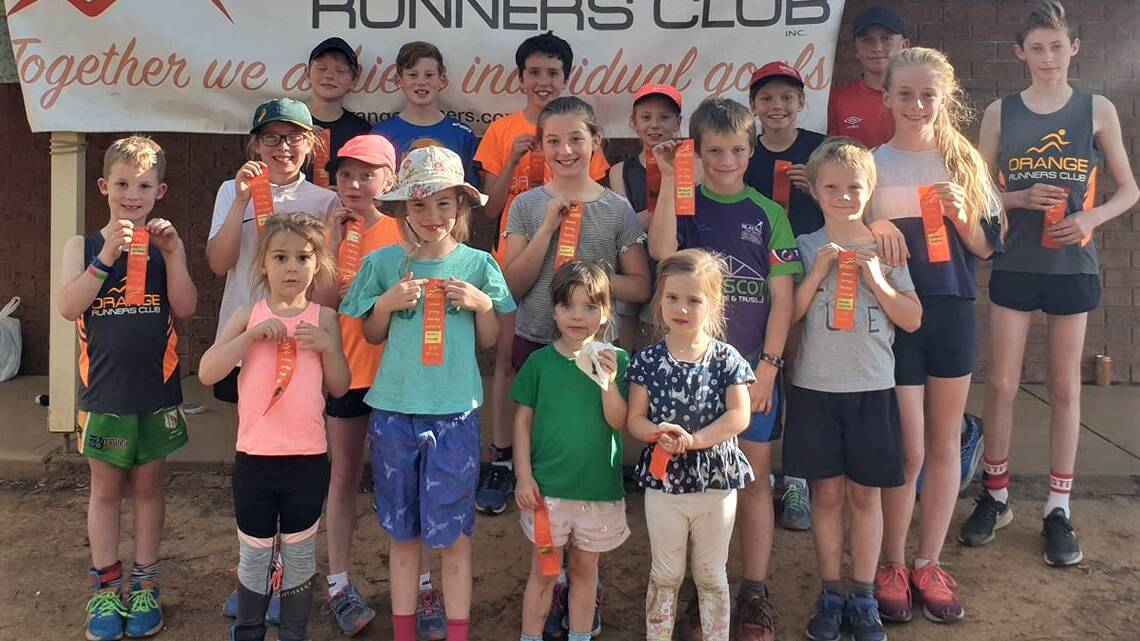 GREAT STUFF: Junior Spring Carnival runners with their ribbons from Wednesday night's races. Photo: CONTRIBUTED