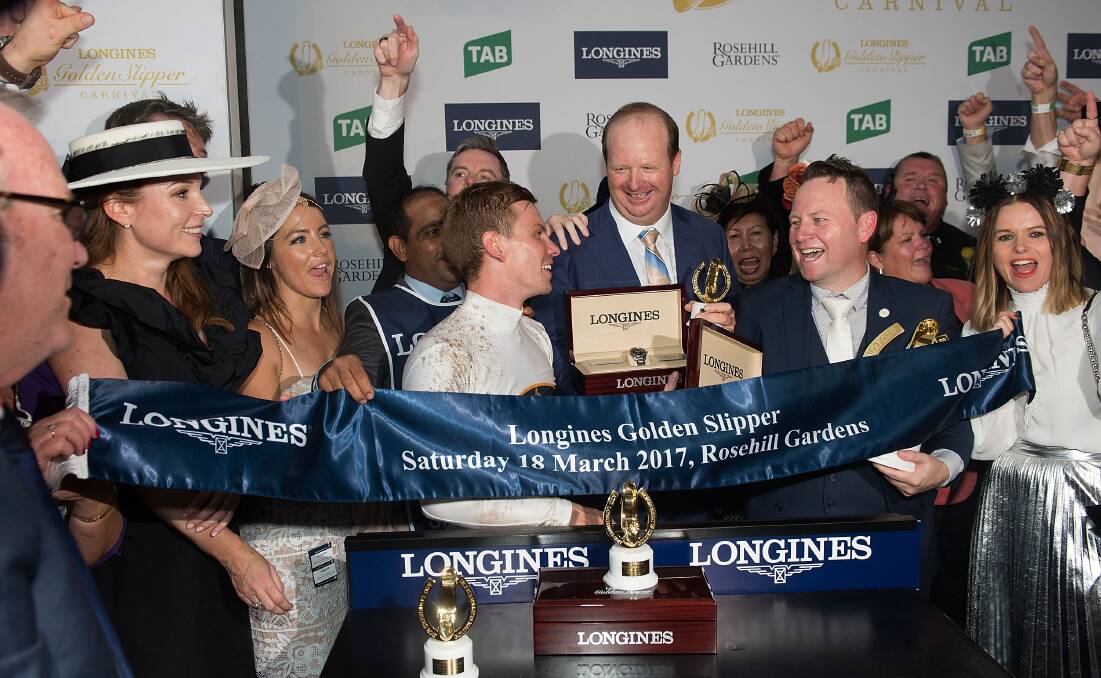 CHAMPION: Former Orange trainer Gary Portelli (centre) celebrates She Will Reign's Golden Slipper victory with jockey Ben Melhem and connections to the horse. Photo: GETTY IMAGES