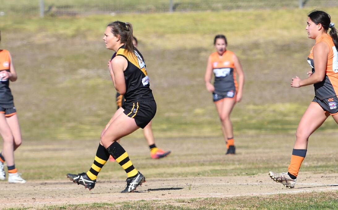MAJOR PERFORMANCE: Orange Tigerettes recruit Bec Ford takes a mark against the Bathurst Giants earlier this season. She kicked three goals in the side's win over Cowra on Saturday. Photo: ALEXANDER GRANT