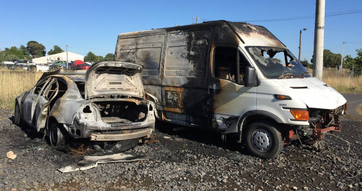 FIRED UP: A Holden Commodore and panel van were completely destroyed by a fire on McNeilly Avenue early on Thursday morning. Photo: JUDE KEOGH