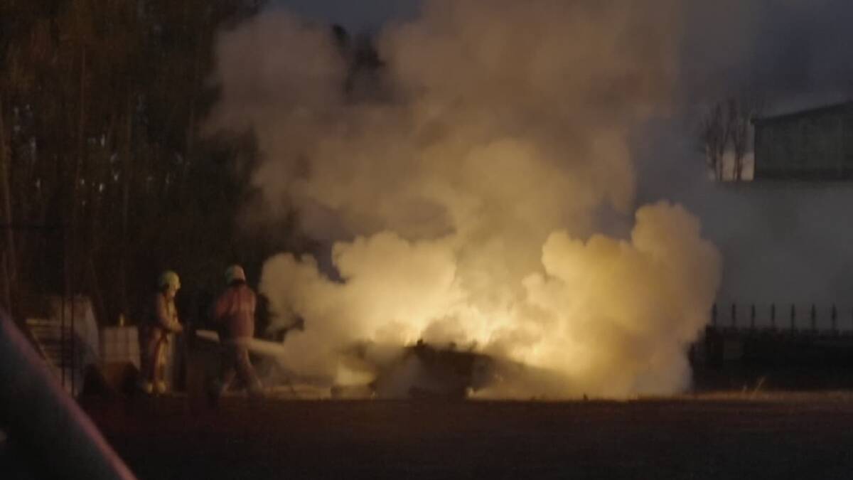 RESPONSE: Fire crews extinguish the blaze on Wednesday night, which appeared to be sparked by a tractor. Photo: TOP NOTCH VIDEO