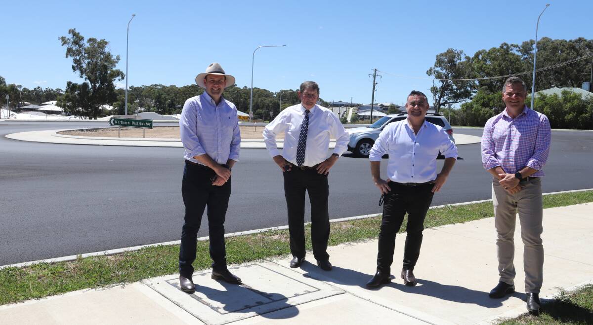 SPINNING AROUND: Nationals MLC Sam Farraway, mayor Reg Kidd, Deputy premier John Barilaro and state MP Phil Donato at the opening of Orange's newest roundabout, the city's 45th. Photo: CARLA FREEDMAN