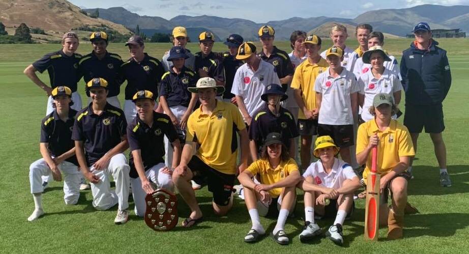 NEW PRIZE: Orange and Wakatipu come together to show off the new Sharpe-Mawhinney Shield, which the latter side claimed on Monday. Photo: ODJCA