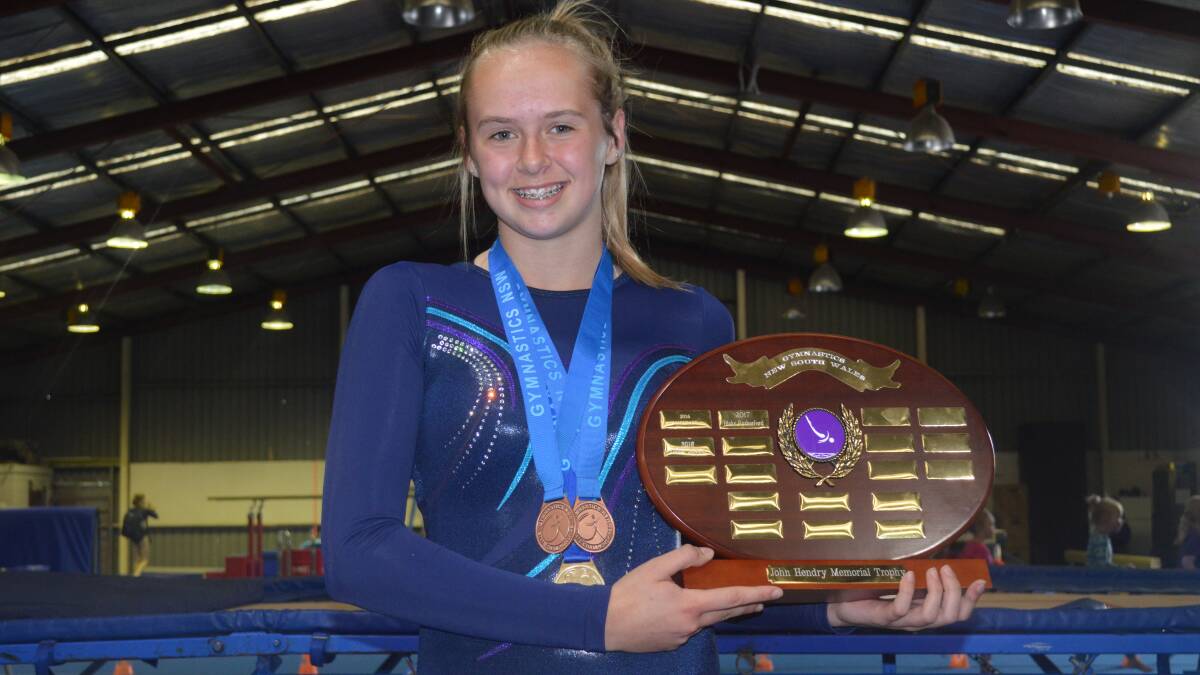 STAR OF THE SHOW: Chloe Jaques shows off her spoils from this month's Gymnastics NSW State Levels Championships, where she cleaned up. Photo: MATT FINDLAY
