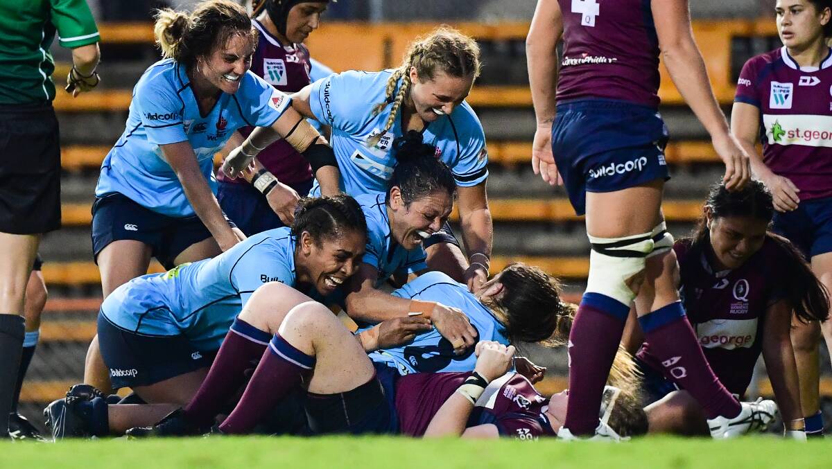 MATCH-WINNER: The Waratahs swamp Grace Hamilton after she scored what was ultimately the title-winning try. Photo: RUGBY AU MEDIA/ STUART WALMSLEY
