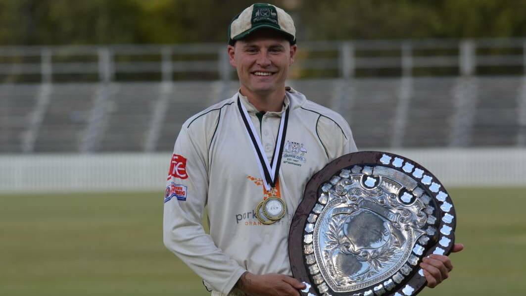 THE SPOILS: Ed Morrish shows of the Challenge Shield along with his player-of-the-final medal from last year's decider. Photo: MATT FINDLAY