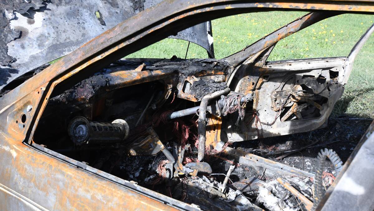 DESTROYED: The inside of the stolen BMW torched on Wednesday morning. Photo: JUDE KEOGH