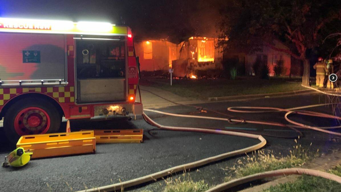 HOUSE FIRE: House alight at Parkes overnight, with firefighters on scene. Photo: FIRE AND RESCUE NSW
