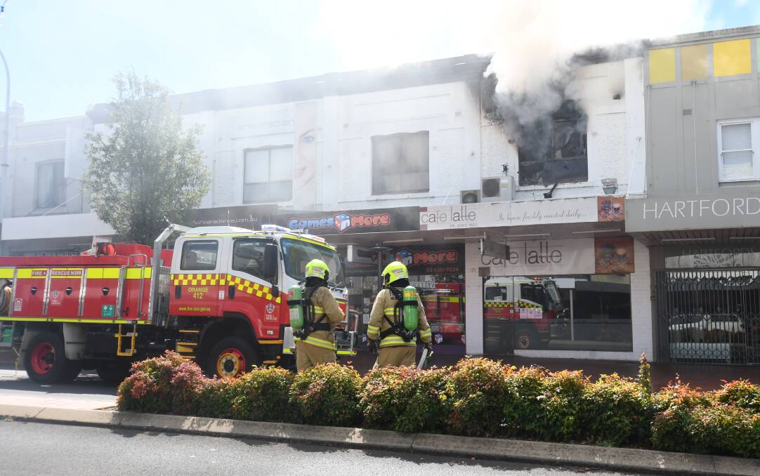 INFERNO: Fire crews from Bathurst and Kelso were called in to help fight a blaze on Orange's main street on Monday afternoon. Photo: CARLA FREEDMAN