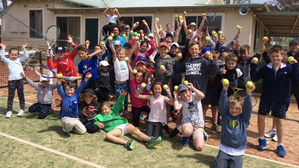 HAVING A BALL: Coach Stuart and the kids at this week's school holiday clinic. Photo: CONTRIBUTED