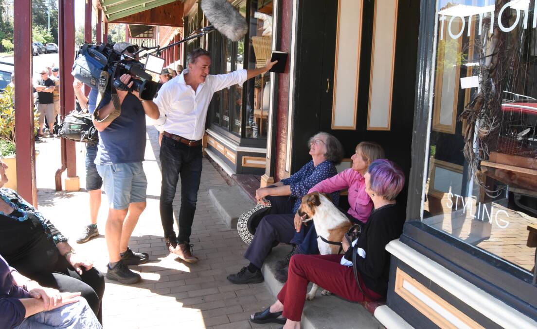 COMMUNITY CALL: A Current Affair's Brady Halls chats with Carcoar locals during Monday's visit to the town. Photo: MARK LOGAN