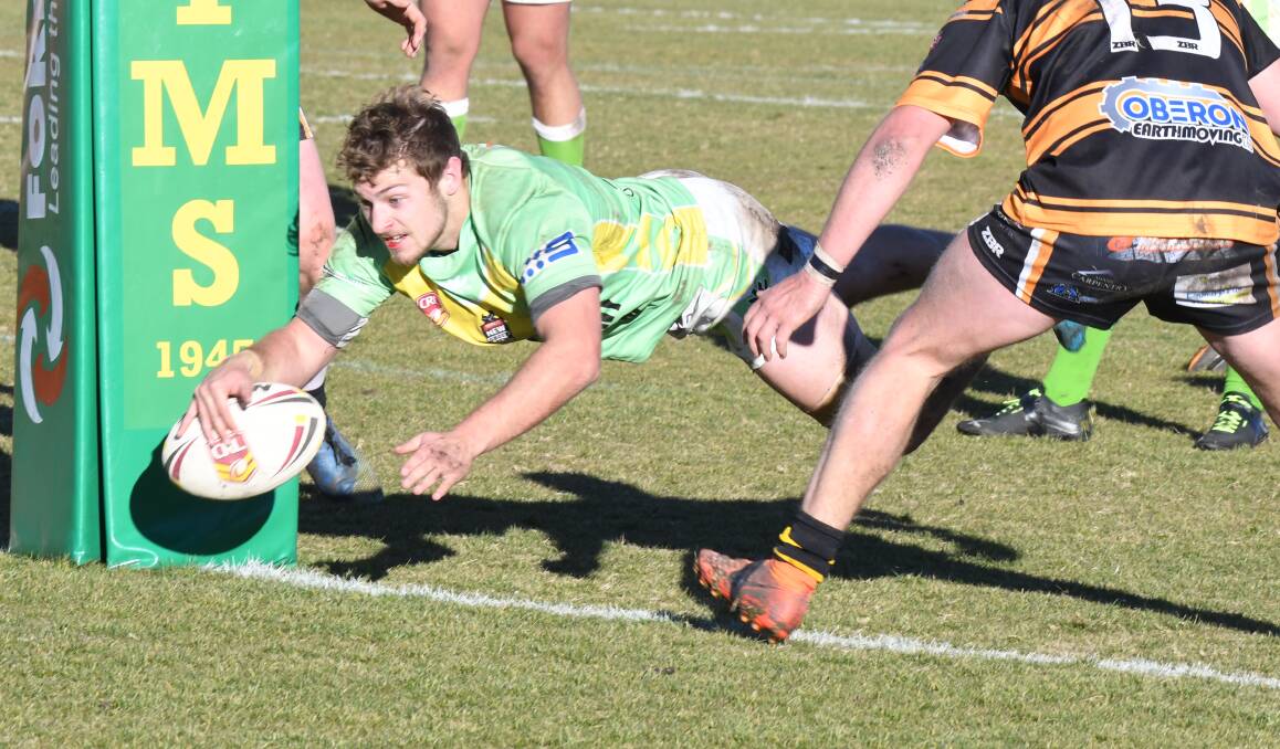 STARRING ROLE: Ryan Griffin dives over for the first of his two second-half tries in Sunday's easy win over Oberon. Photo: CARLA FREEDMAN