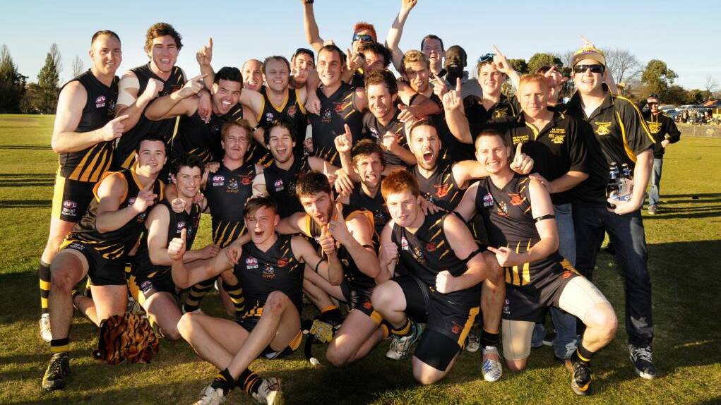 TIGERS ROAR: The Orange Tigers celebrate their stunning, upset grand final win over the Bushrangers in 2013. Photo: WESTERN ADVOCATE