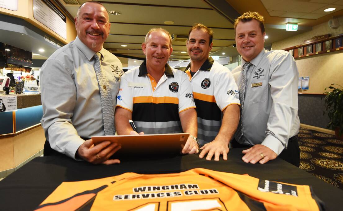PRODIGAL SON: Wingham Services Club officials Ron Sullivan (left) and Craig Madeley with Tigers president Scott Blanch and new captain-coach Mick Sullivan. Photo: WINGHAM CHRONICLE