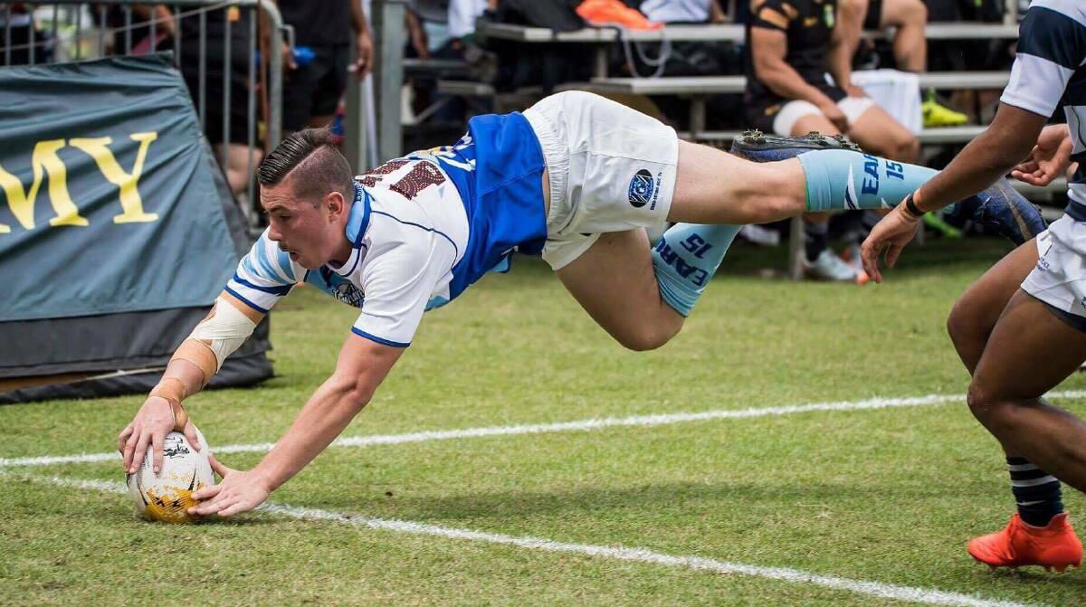 THE FINISHER: Emus centre Aidan Baker dives over to score for East Arnhem in its Bowl-winning SCC International Sevens campaign earlier this month. Photo: SUPPLIED