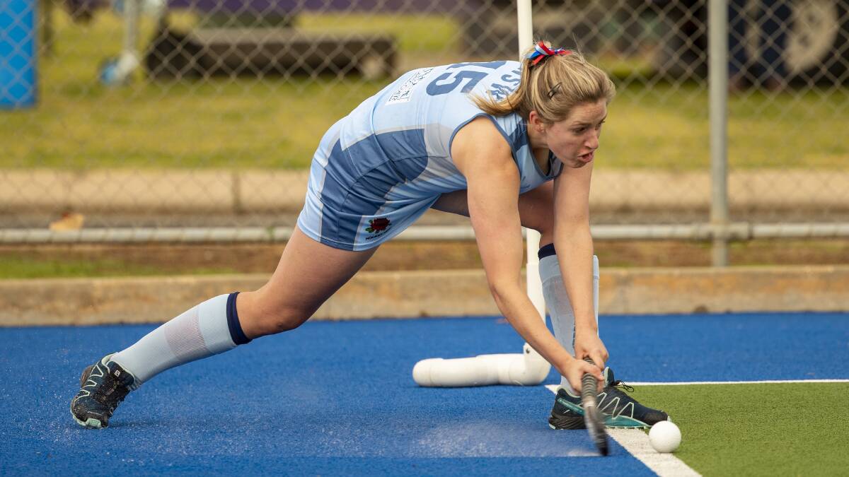 SILVER LINING: CYMS' Rach Hoey flicks a pass into the circle during NSW's silver medal-winning campaign. She was one of five Orange stars named in Australian Country sides. Photo: CLICK INFOCUS