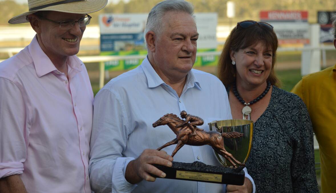 CHAMPION AGAIN: Hawkesbury's Garry White shows off his spoils from Friday's Gold Cup win, the fifth time he's claimed victory in Racing Orange's showcase.