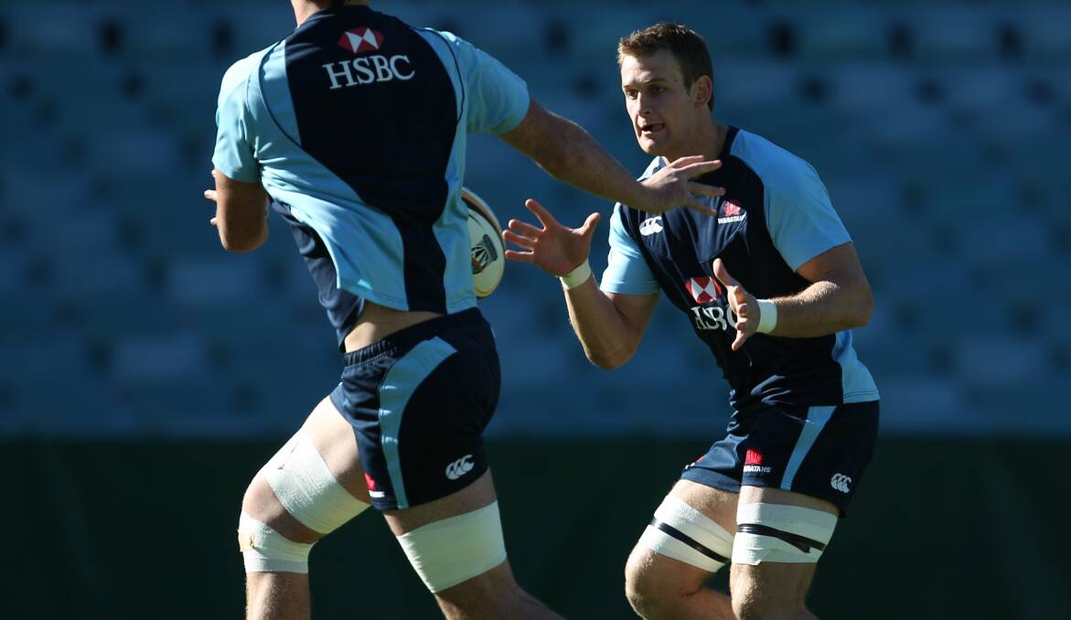 NSW STATE OF MIND: McCutcheon rolls through a training session with the Waratahs back in 2010. Photo: AAP