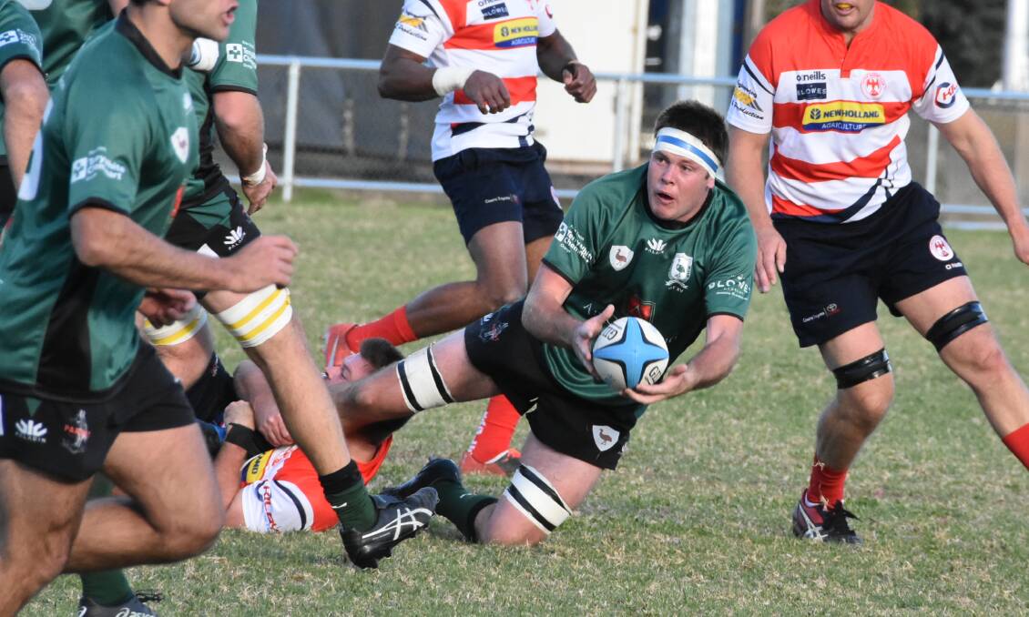 OFFLOAD: Emus' second-rower Sam McLean dishes off in the premiers' tough victory over Cowra on Saturday afternoon. Photo: COWRA GUARDIAN