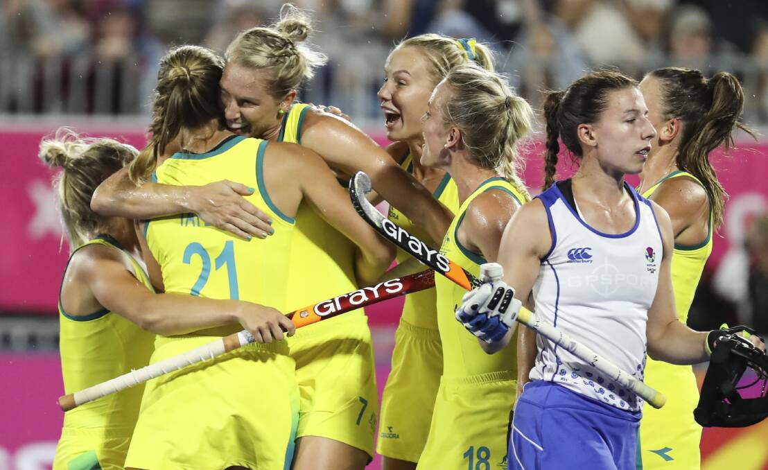 UNDEFEATED: The Hockeyroos celebrate their win over Scotland on Tuesday, which kept them unbeaten and set-up a semi-final showdown against India on Thursday night. Photo: HOCKEY AUSTRALIA