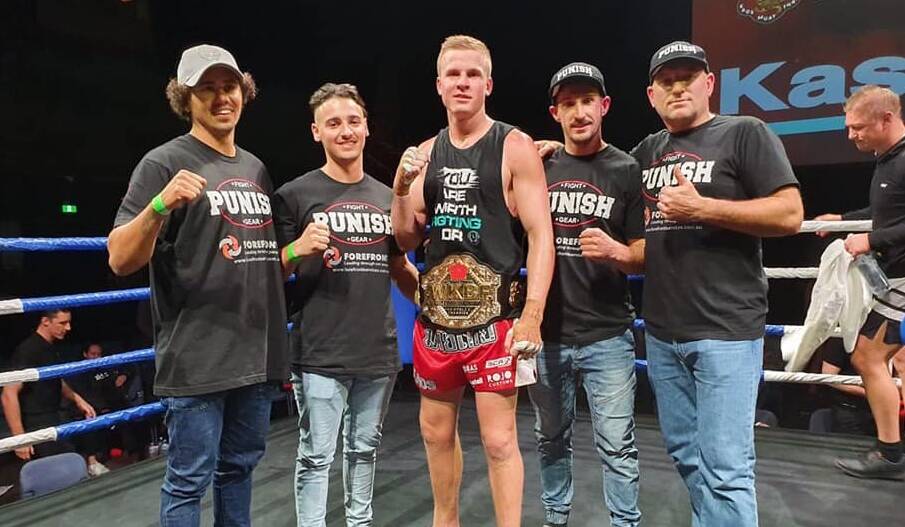 WORLD CHAMPION: Charlie Bubb and his team celebrate winning the WKBF K1 world title earlier this year, one feat which earned him a Pro Fighter of the Year nomination. Photo: FACEBOOK