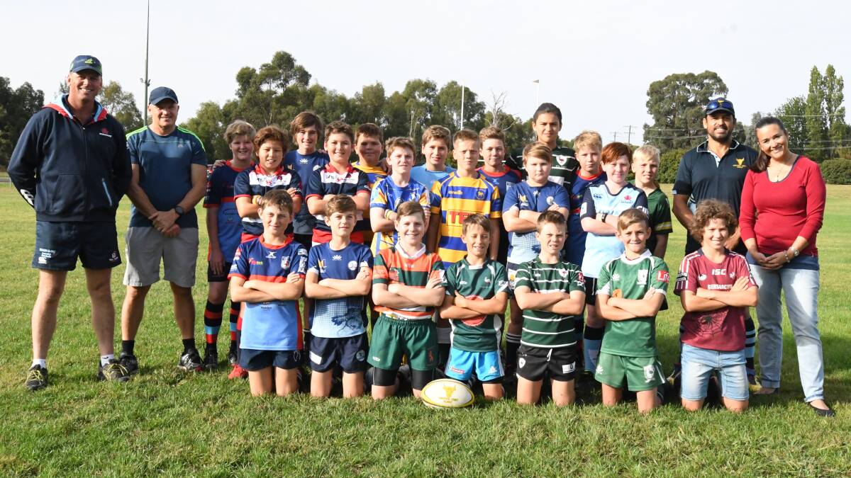 YOUNG GUNS: Central West's wider under-12 playing group, along with their coaches and managers, at a recent training session at Endeavour Oval. The Japan tour will aid their country championship preparation. Photo: CARLA FREEDMAN