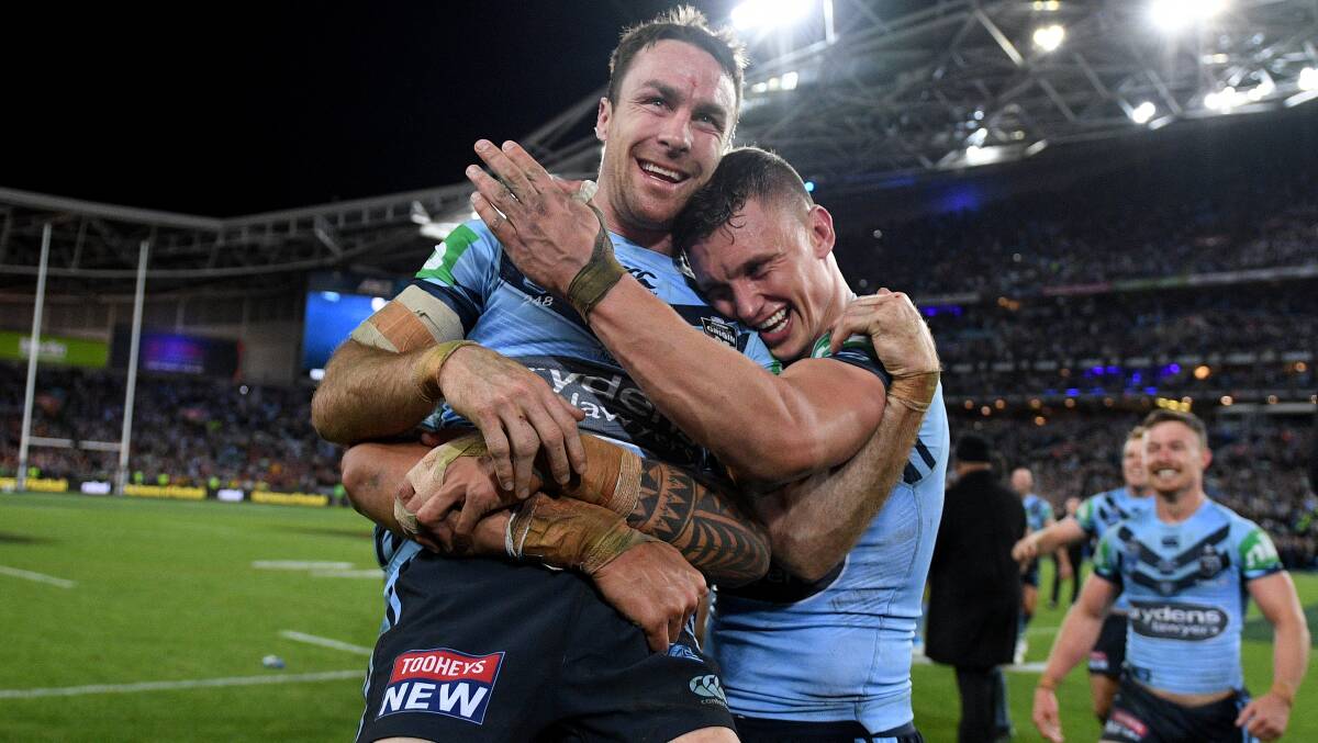 BLUES BROTHERS: Orange products James Maloney and Jack Wighton celebrat Wednesday night's series-deciding victory. Photo: AAP/DAN HIMBRECHTS