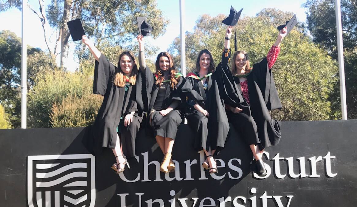 HATS OFF: Amber Benson, Anneke Pretorius, Rachel Vickery and Jessica Matthews celebrated their graduation this week. Photo: CHARLES STURT UNIVERSITY