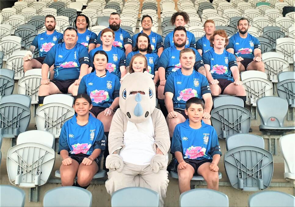 COMMUNITY-MINDED: Dubbo Rhinos' senior and junior players show off their one-off jerseys for this weekend, part of their charity round. Photo: CONTRIBUTED